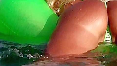 Blonde milf showing her ass in tiny bikini