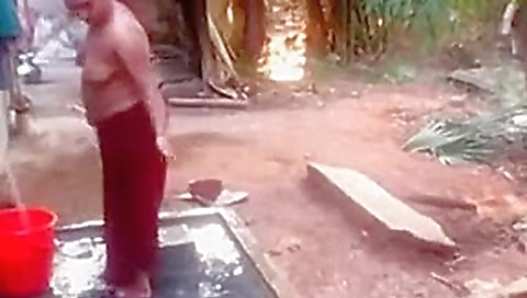 catches village aunty bathing nude outside -