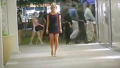 A classy chick flashes her body in public.
